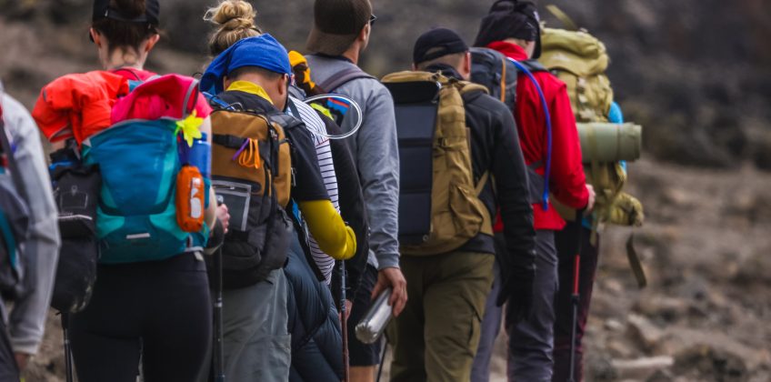 A,Group,Of,Active,Tourists,Climbing,To,The,Top,Of